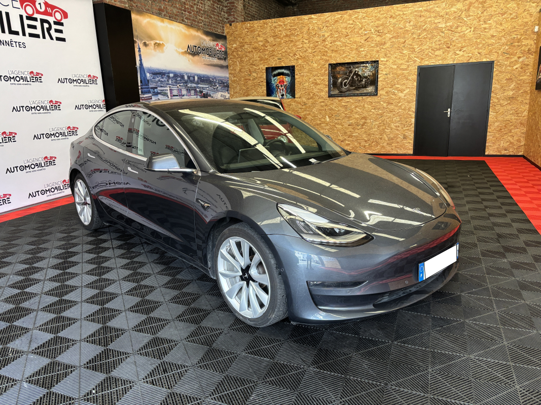 Tesla Model 3 — 3